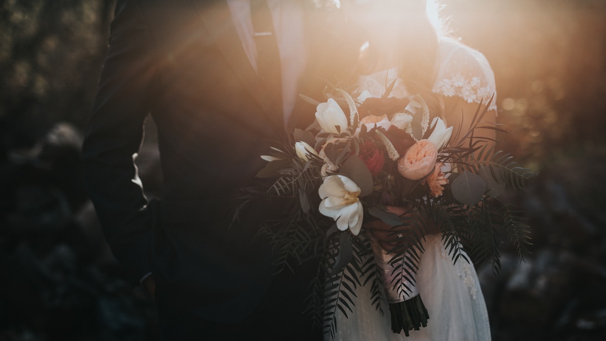 Bride and groom with branded wedding signage